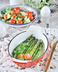 Breakfast of baked asparagus with boiled egg and cream cheese