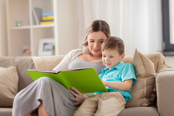 happy family reading book at home