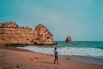 Sunset Algarve Portugal coastline with rocky beach scenery, 