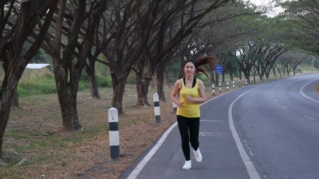 4k of fitness woman running in the park