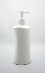 Fototapeta na wymiar White plastic dispencer with liquid soap isolated on white