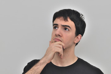 portrait of a pensive young man on a white background