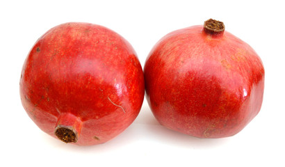 Ripe pomegranates on white