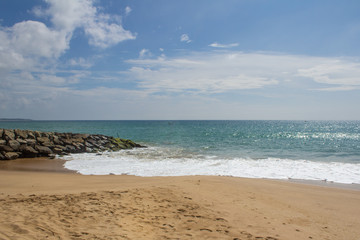 Beautiful beach. View of nice tropical beach with palms around. Holiday and vacation concept. Tropical beach.
