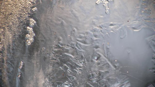 The freezing of water and the formation of ice on the glass