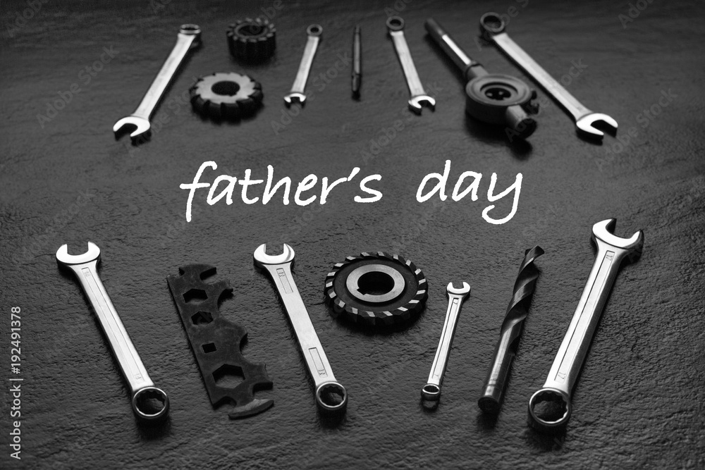 Wall mural fathers day message with tool set. black textured background.