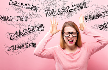 Deadline with young woman feeling stressed on a pink background