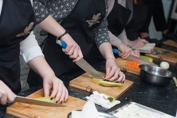 Woman's Hands Chopping Vegetables in the kitchen Preparing Food. Cooking Process.