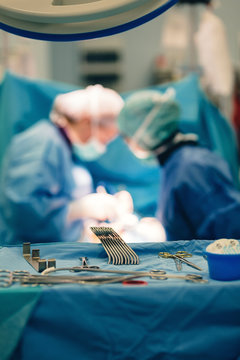 Surgical room in hospital with medical team of surgeons doing minimal invasive surgical interventions. Surgery operating room with electrocautery equipment for cardiovascular emergency surgery center