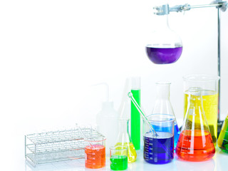 Laboratory glassware with colorful chemical reagent in research laboratory 
