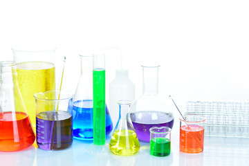 Laboratory glassware with colorful chemical reagent in research laboratory 
