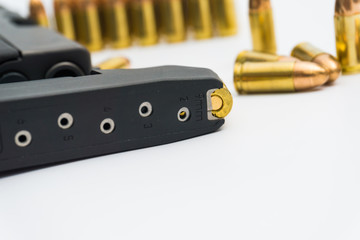 9mm bullet with semi automatic gun isolated on white