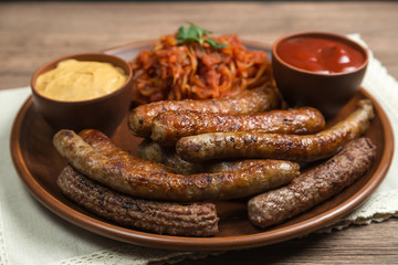 Assorted fried sausages and stewed cabbage. 