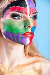 Young attractive girl with face art make-up