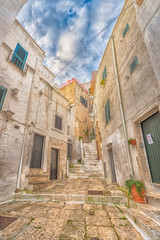 Fototapeta na wymiar Alleyway in old white town Ostuni, Puglia, Italy