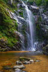 Spectacular waterfall on a rocky cliff