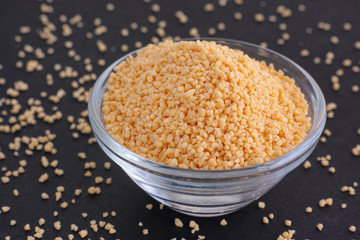  Soy lecithin in a bowl on black background