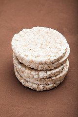 The popped buckwheat gluten free bread on a brown background.