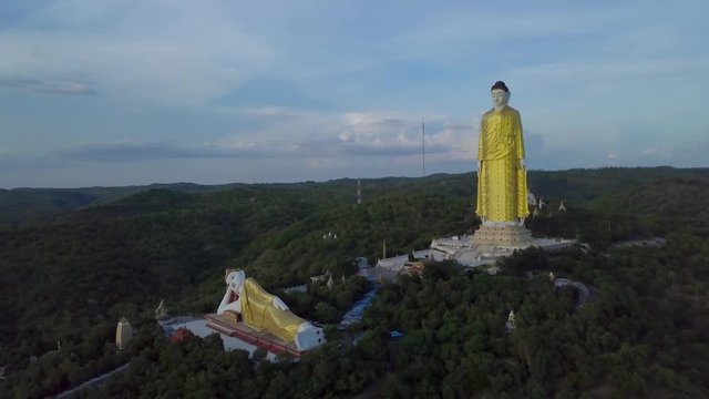 Flying around giant buddhas located in Monywa mountains, Myanmar