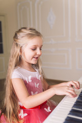 little girl play on piano
