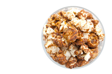 Chocolate popcorn in a transparent glass isolated on white