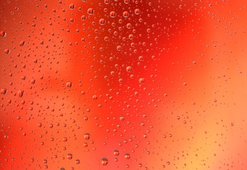 Water drops on red gradient background. Love, passion, heart, desire, action, romance concept.