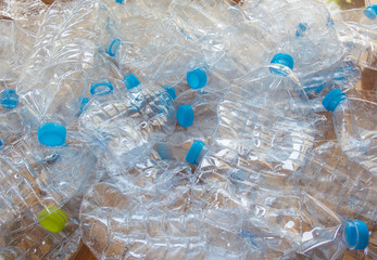 Empty plastic bottles of water for recycle on white background