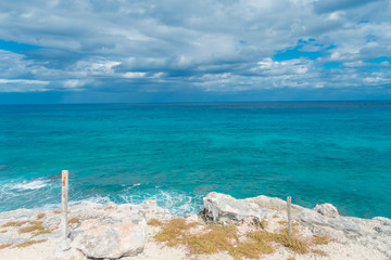 Beautiful outdoor view on the edge of the cliff Isla Mujeres Punta sun caribbean sea, with a turquoise water and gorgeous sunny day in Mexico
