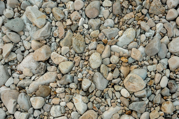 Large amount of round sea pebbles. Different shapes and colors
