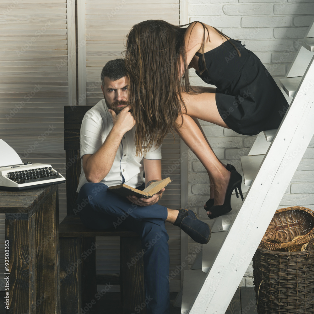 Wall mural couple in love read book together