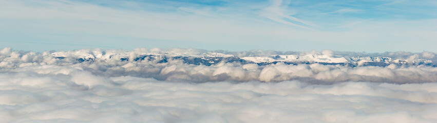 Fototapeta na wymiar The Jura mountain emerging from the winter fog.