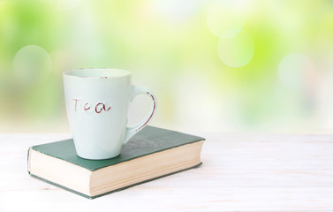 Mug and book on a table