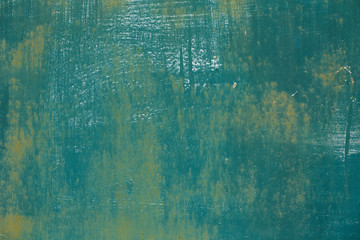 texture of the painted metal wall emerald spotted, close-up