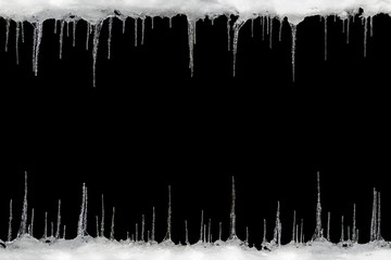 Icicles on a black background, space for text, template for design - obrazy, fototapety, plakaty