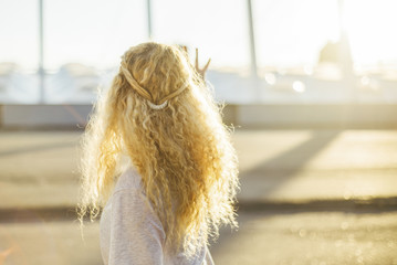 Girl with curly hair in the sunshine