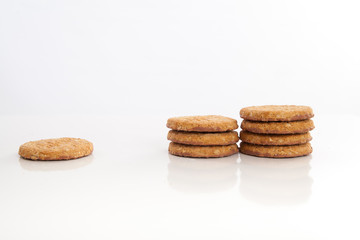 piles of round cookies on studio white background