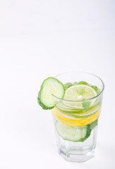 Detox Infused Water with Lemon, Lime,Cucumber and Mint in glass on a White Background.Healthy Beverage.Food diet concept.Vegetarian.selective focus.
