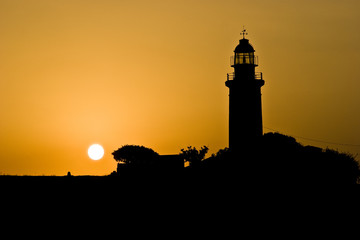 Fototapeta na wymiar Lighthouse of Paphos at sunset