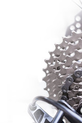 Mountain bike wheel and gear detail with a new clean chain and metal chain rings