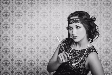 brunette girl in black dress in the style of the decadence keeps mouthpiece