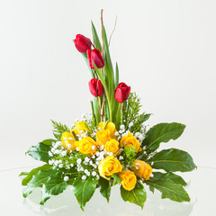 Decorative flower arrangement made of roses and tulips