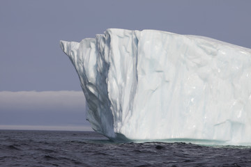 Giant icebergs floating down from Greenland to the coast of Newfoundland, Maritime province in...