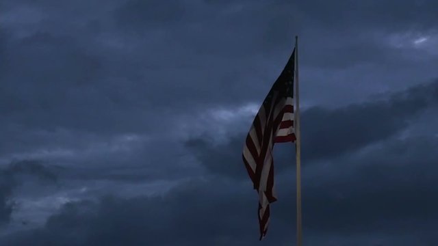1986 American Flag at Dusk with Birds Flying by in Slow Motion 