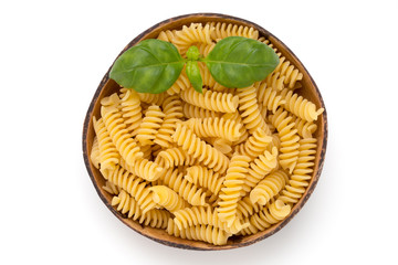Uncooked fusilli pasta isolated white background.