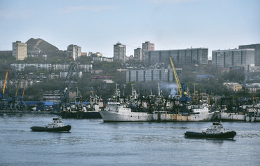 Port, Golden Horn Bay with ships in the background of the city of Vladivostok, Russia.