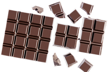 Chocolate cubes, pieces of bitter, dark chocolate bar, isolated on white background, top view