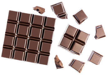 Chocolate cubes, pieces of bitter, dark chocolate bar, isolated on white background, top view
