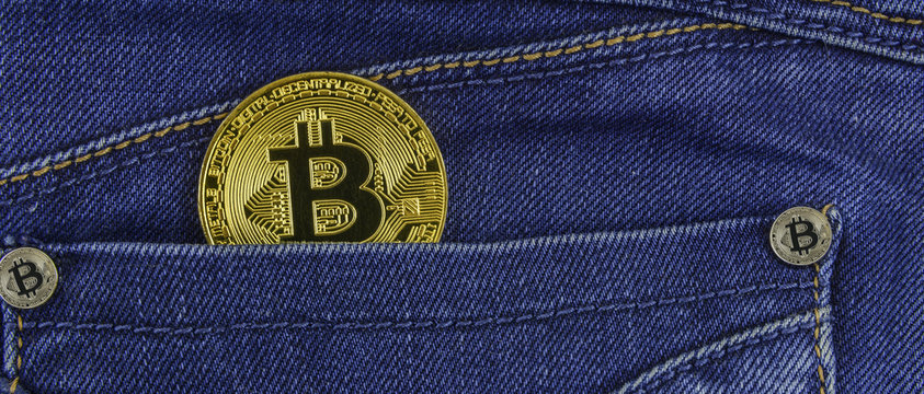Bitcoin lies in the pocket of blue jeans