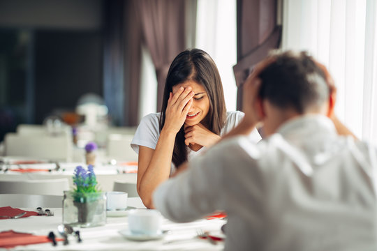 Crying stressed woman in fear,having a conversation with a man about problems.Reaction to negative event,handling bad news.Breaking up relationship.Emotional sad troubled woman expression.Miscarriage