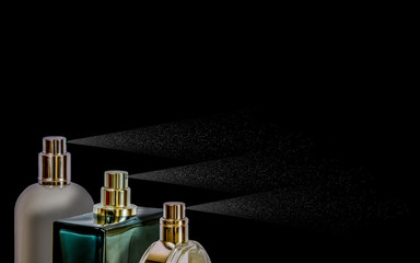 Spraying bottles of perfume